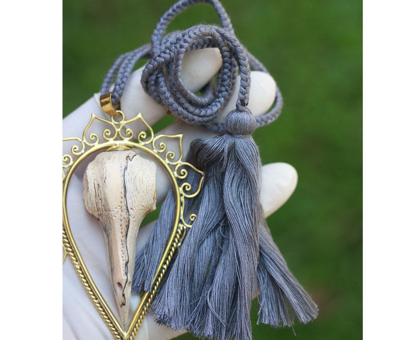 Bids skull and brass pendant hand made tamarind wood exclusive designs by tribal island price per piece. set in brass SALES