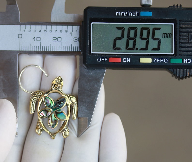 Turtle brass and abalone shell inlay earrings with silver post price per pair.