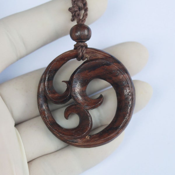 Maori koru triple spirals pendant . sono wood ,hand carved.