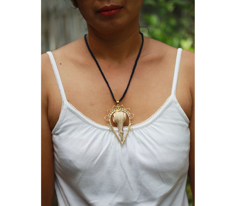 Bids skull and brass pendant hand made tamarind wood exclusive designs by tribal island price per piece. set in brass SALES