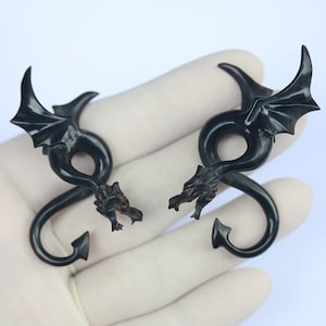 Dragon , twisted styles, water buffalo horn. real gauges, hand made. price per pair