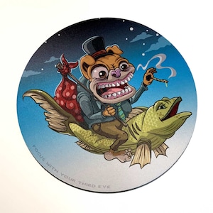 May include: A cartoon illustration of a dog wearing a top hat and riding a fish. The dog has a toothy grin and is holding a stick. The fish is green and has a large mouth. The background is a blue sky with clouds. The text "Focus with your third eye" is written at the bottom of the image.