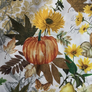 May include: A white background with a watercolor design featuring pumpkins, sunflowers, leaves, and butterflies. The pumpkins are orange, the sunflowers are yellow, and the leaves are various shades of brown and green. The design has the words "Grateful" and "Apple" in script.