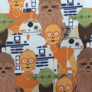 May include: A colorful fabric with a repeating pattern of Star Wars characters, including Yoda, Chewbacca, R2-D2, C-3PO, and a Stormtrooper. The characters are depicted in a cartoon style and are set against a white background.