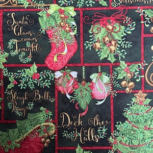 May include: A black fabric featuring a repeating Christmas pattern with red stockings, green pine trees, gold sleigh bells, and red sleighs. The text includes Santa Claus comes tonight, Sleigh Bells Ring, and Deck the Halls in gold script lettering.