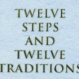 May include: A book titled "Twelve Steps and Twelve Traditions" with a blue cover and gold lettering.