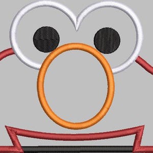 May include: Red, white, and orange embroidered design of a cartoon character with large eyes and a round nose.