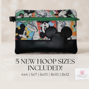 May include: A rectangular zippered pouch featuring a colorful comic book print of Mickey Mouse with a green zipper and a black faux leather bottom panel with a prominent Mickey Mouse ear silhouette applique. Text reads: 5 NEW HOOP SIZES INCLUDED! 4x4 | 5x7 | 6x10 | 8x10 | 8x12.