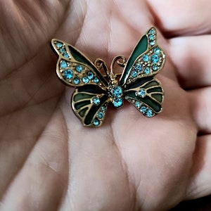 LC Liz Claiborne enamel GiIlloche butterfly brooch with blue rhinestones.