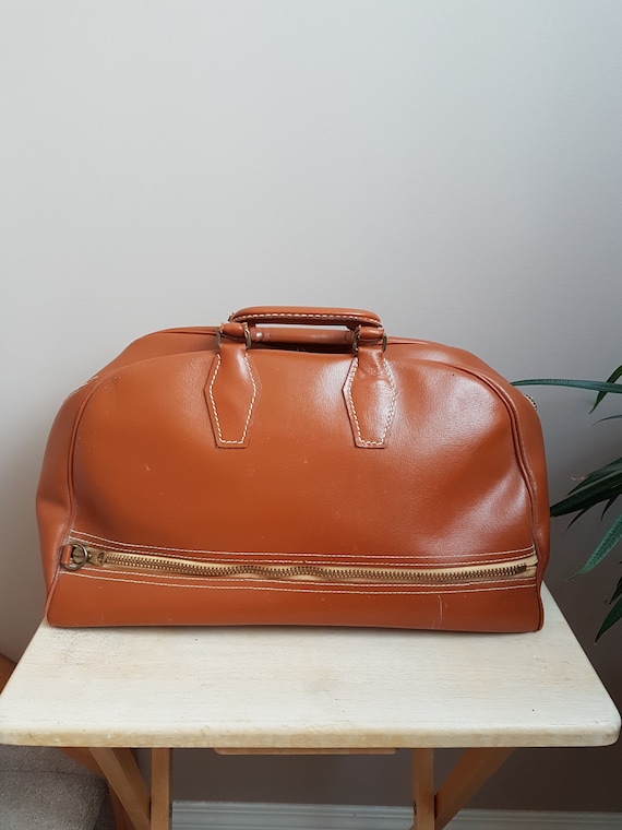 Sale. Mc Brine Baggage Vintage Travel BagLuggage. Caramel Brown Carry on bag. Vintage Travel Luggage Bag. Made in Canada Bag.. Sale. Mc Brine Baggage Vintage Travel BagLuggage. Caramel Brown Carry on bag. Vintage Travel Luggage Bag. Made in Canada Bag..