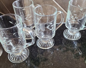 Set of 4 vintage Princess House Irish tea coffee footed clear etched glass mugs with floral design.