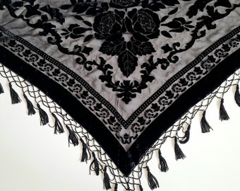 Triangle shape black see-through shawl with shiny beaded tussles and floral design. Vintage accessories. Evening outfit.