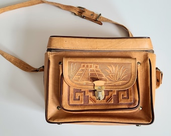 Vintage handmade tooled leather camera bag.