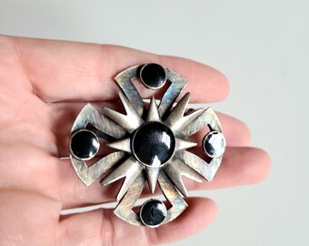 Large vintage silver color metal brutalist style brooch with faux Onyx stones. Oversized round floral brooch.