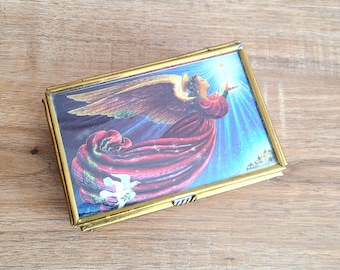 Vintage glass and brass footed jewelry or trinket box with angel and doves design on lid and mirrored base. Home decor. Religious gift.