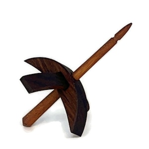 May include: A wooden spinning wheel with a dark brown base and a light brown spindle.