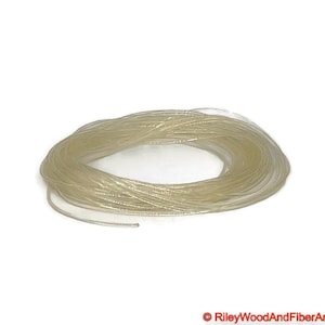 three thirty seconds clear polyurethane drive band material. It is a 100-foot roll coiled up forming kind of a large clear donut made of spaghetti.