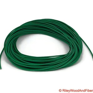 one eight green polyurethane drive band material.  It is a 100-foot roll coiled up forming kind of a large green donut made of spaghetti.