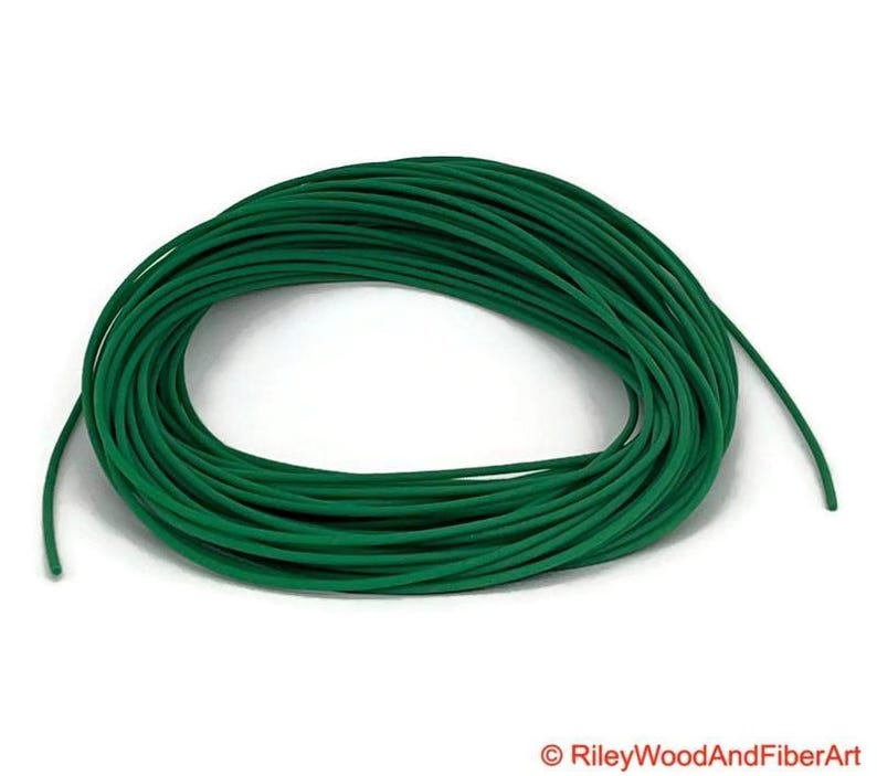 one eight green polyurethane drive band material.  It is a 100-foot roll coiled up forming kind of a large green donut made of spaghetti.