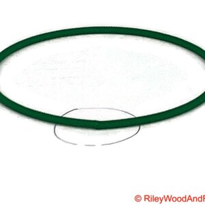 a piece of green drive band material. it is joined and has a circle indicating where the join is.