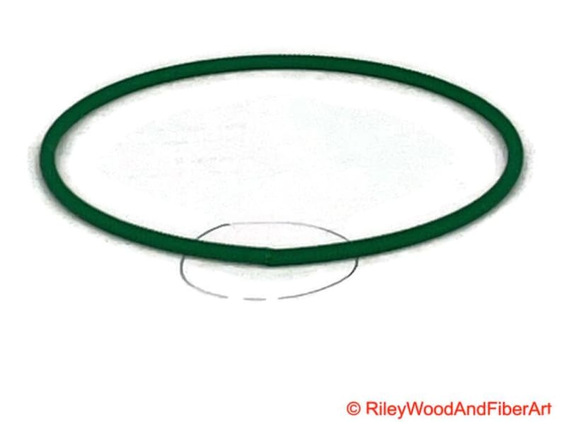a piece of green drive band material. it is joined and has a circle indicating where the join is.
