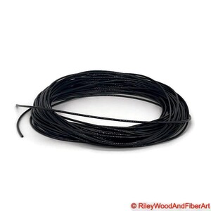 one eight black polyurethane drive band material.  It is a 100-foot roll coiled up forming kind of a large black donut made of spaghetti.