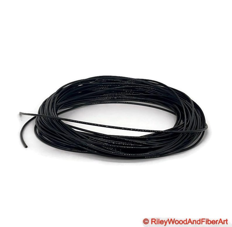 one eight black polyurethane drive band material.  It is a 100-foot roll coiled up forming kind of a large black donut made of spaghetti.