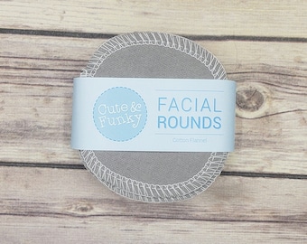 May include: Gray cotton flannel facial rounds with a blue and white label that says "Cute & Funky" and "Facial Rounds Cotton Flannel"