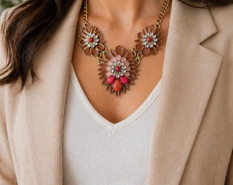 NY & Co bloemen statement slabbetje strass goud