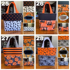 May include: Four Halloween-themed tote bags with different patterns. The bags are made of fabric and have orange and black colours. The bags are numbered 25, 26, 27, and 28.