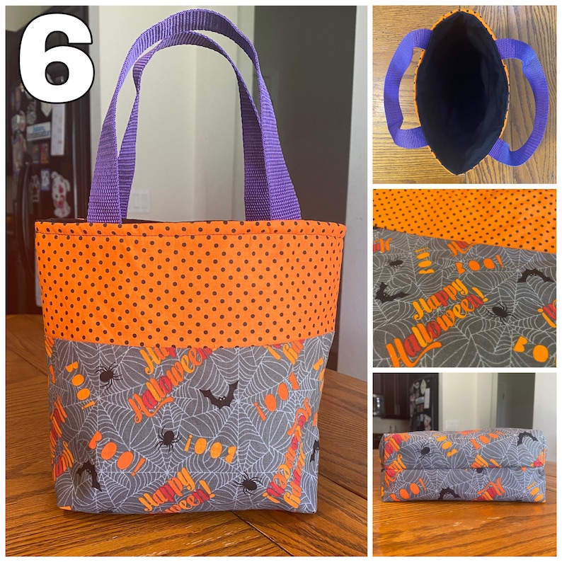 May include: A small purple-handled Halloween trick-or-treat bag with an orange and black polka dot fabric top and a gray fabric bottom with a spiderweb and bat pattern. The bag has the words "Happy Halloween!" printed on it.