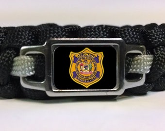 Thin Silver Line Delaware Department of Corrections DOC Patch on Black Paracord Survival Bracelet Keychain Lanyard and Multi Sets