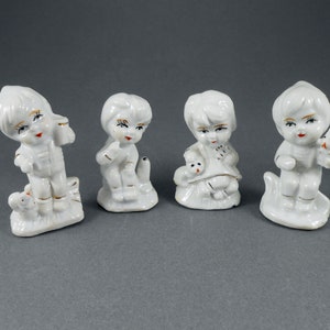 Vintage Porcelain Children Figurines: White & Gold Accent Decor, Set of 4