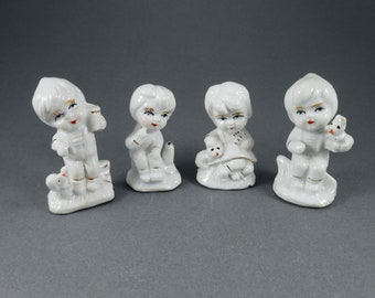 Vintage Porcelain Children Figurines: White & Gold Accent Decor, Set of 4