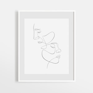 Peut inclure: Un dessin au trait noir et blanc de deux visages, l'un au-dessus de l'autre, les yeux fermés. Les visages sont dessinés dans un style minimaliste, avec seulement les traits essentiels.