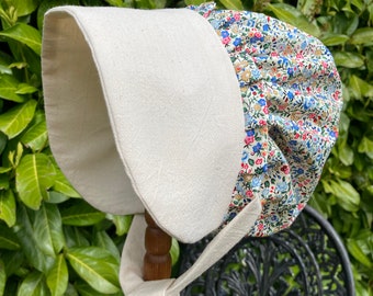 Child's bonnet.  Victorian, Old fashioned style bonnet. book Day. Stage. Victorian Day.