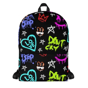 May include: Black backpack with a colorful graffiti pattern. The pattern includes hearts, stars, crowns, and the words "Love", "Don't Cry", and "Stop".