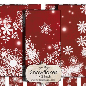 May include: A digital paper pack with a red background and white snowflakes. The pack includes 12 digital papers, each measuring 1 x 2 inches. The text "Snowflakes 1 x 2 inch" is displayed on the paper pack.