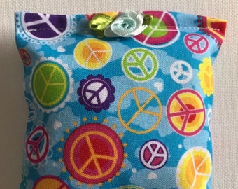 BELTANE Blend Reiki Rest and Relaxation Small Square Herbal Dream Pillow with Small Blue Flower in Rainbow Peace Signs on Blue Fabric