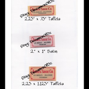 May include: Three rectangular labels with the text "Janes Shoe Co." in red and gold. The labels are labeled with the dimensions and material: 2.25" x .75" Taffeta, 2" x 1" Satin, and 2.25" x 1.125" Taffeta. The Etsy shop name "DreamerOfOz" is also visible.