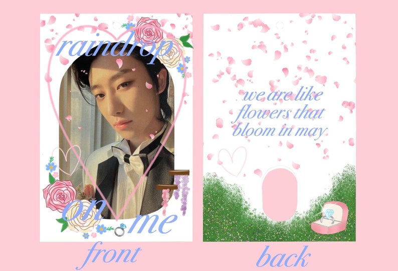 May include: A pink and blue card with a photo of a person on the front. The front of the card has the text "raindrop on me" and a heart shape. The back of the card has the text "we are like flowers that bloom in may." and a ring in a box.