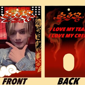May include: A red and gold photo card with a picture of a person in a denim jacket. The card has the text "SUPER" and Chinese characters. The back of the card is red with the text "I LOVE MY TEAM I LOVE MY CREW" and a hole in the center.