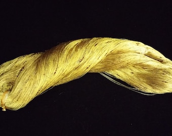 May include: A spool of gold metallic thread, perfect for crafting and adding a touch of sparkle to projects.