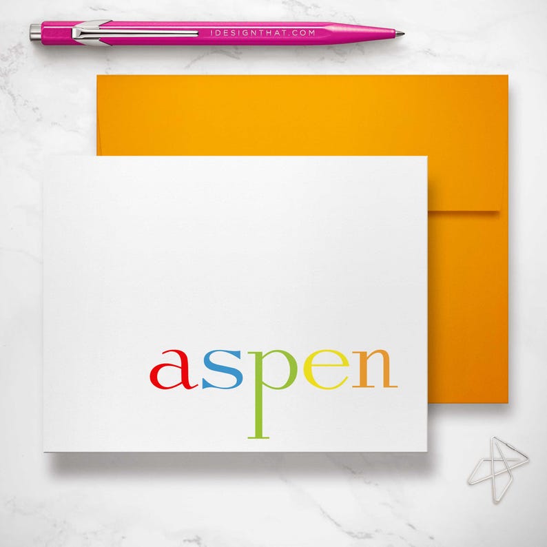 This rainbow stationery card paired with a vibrant orange envelope highlights colorful kids notecards and folded note cards.