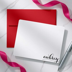 Custom notecard set featuring a bold swash name design and colorful envelope options
