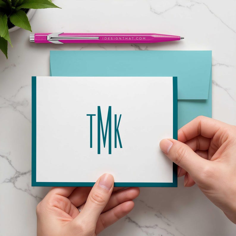 Timeless personalized notecards featuring a narrow vertical monogram that keeps the design polished and uncluttered.