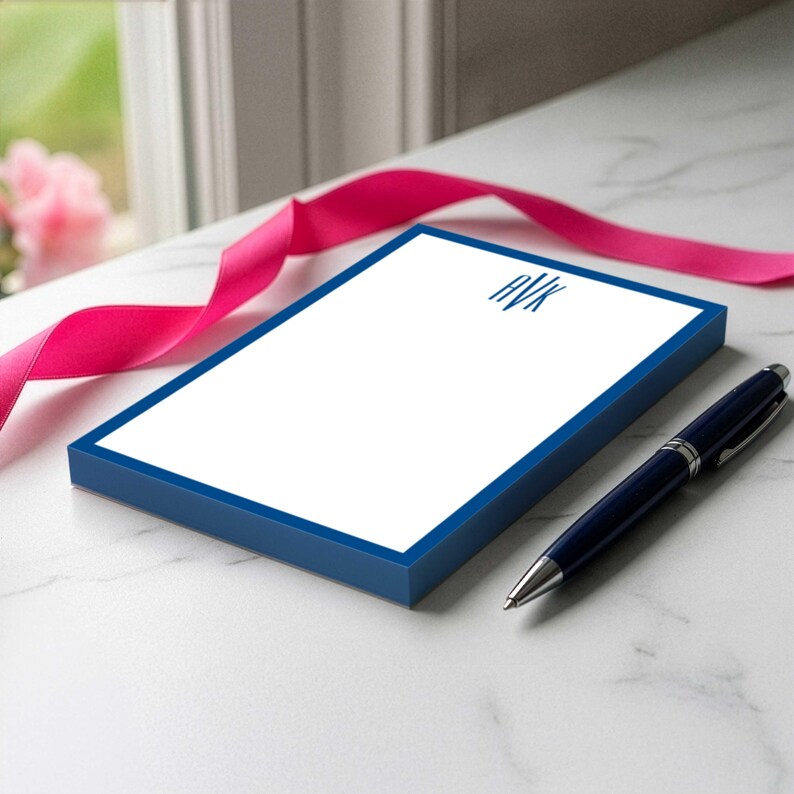 Monogram notepad gift for her with a simple initial layout, open writing space, and personalized name beneath the design.