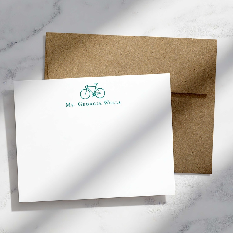 Bike lover gift featuring custom note cards with a bicycle motif, personalized text, and envelopes for everyday correspondence.