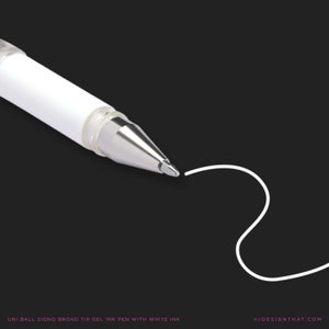 May include: A white Uni-ball Signo broad tip gel ink pen with white ink, shown close-up against a black backdrop, drawing a curved line. The pen features a silver tip and a clear plastic section. Text at the bottom reads "UNI BALL SIGNO BROAD TIP GEL INK PEN WITH WHITE INK".