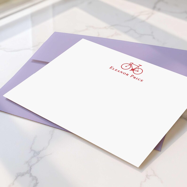 Flat notecard sets with personalized bicycle artwork, matching envelopes, and custom name for polished handwritten correspondence.